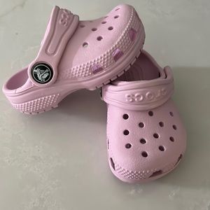 Toddler size 4 Crocs. Color is pale pink. Never worn.